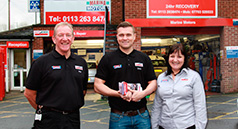 Image of motor mechanic and satisfied customer